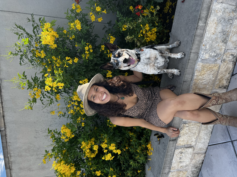 Carmina with white dog, yellow flower background